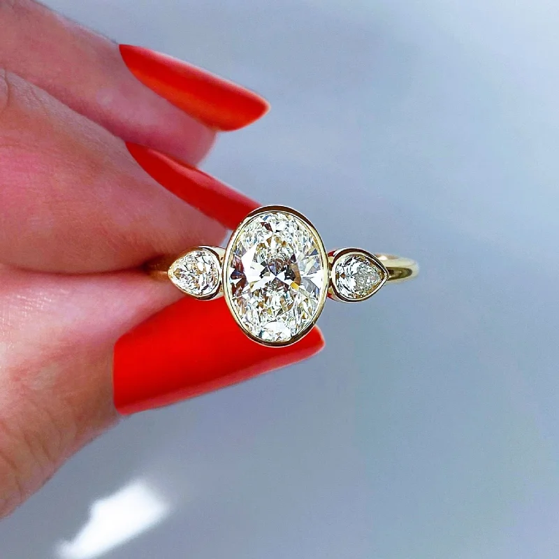 Oval and Pear Shape Diamond Ring